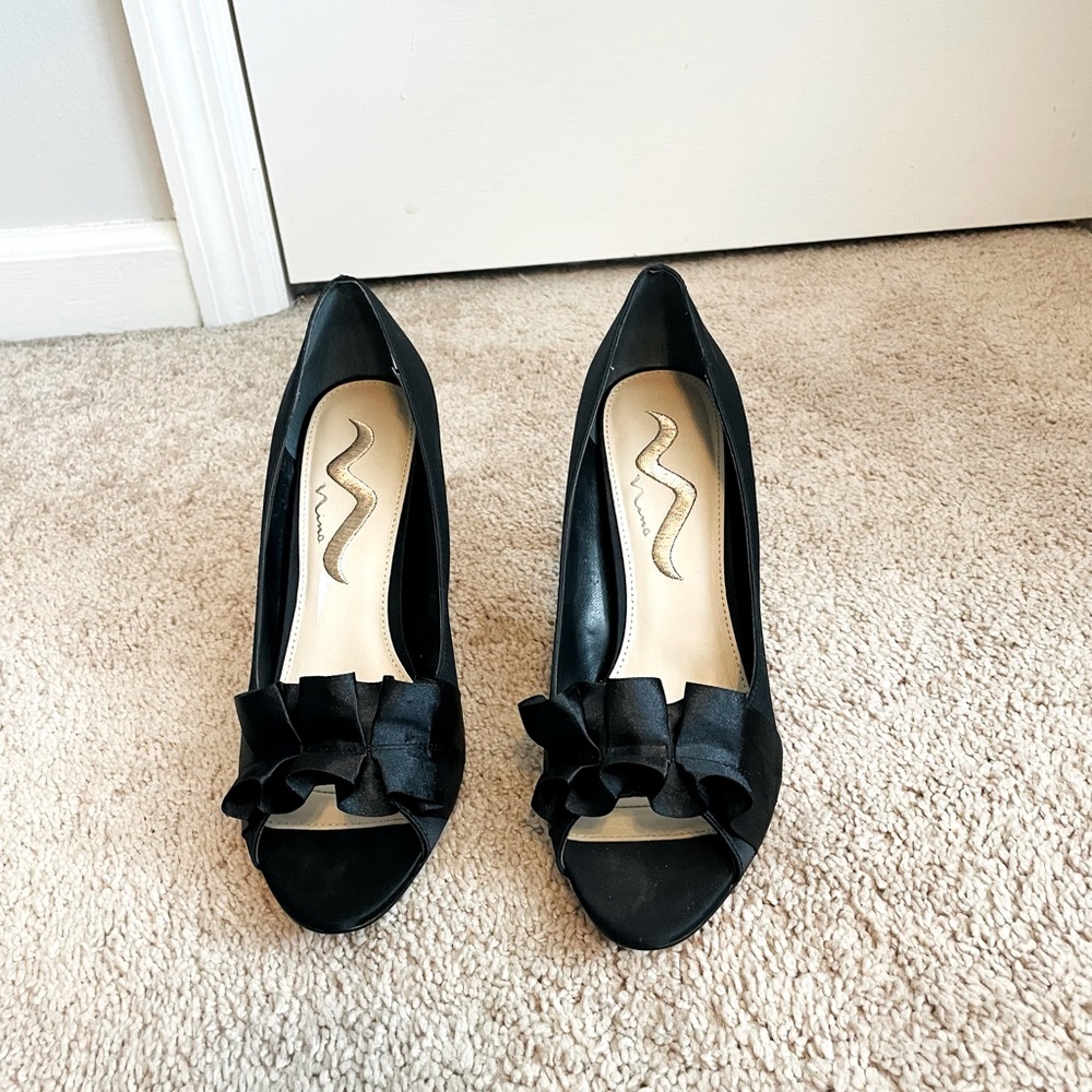 Brand new Nina Satin black pump with leather sole.  Size 10.